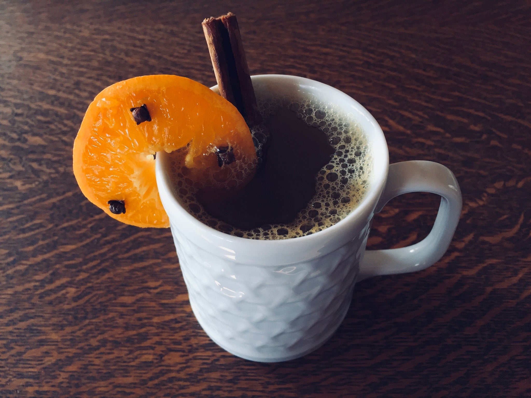 Autumn Hot Toddy with Whole Cloves and Clementine