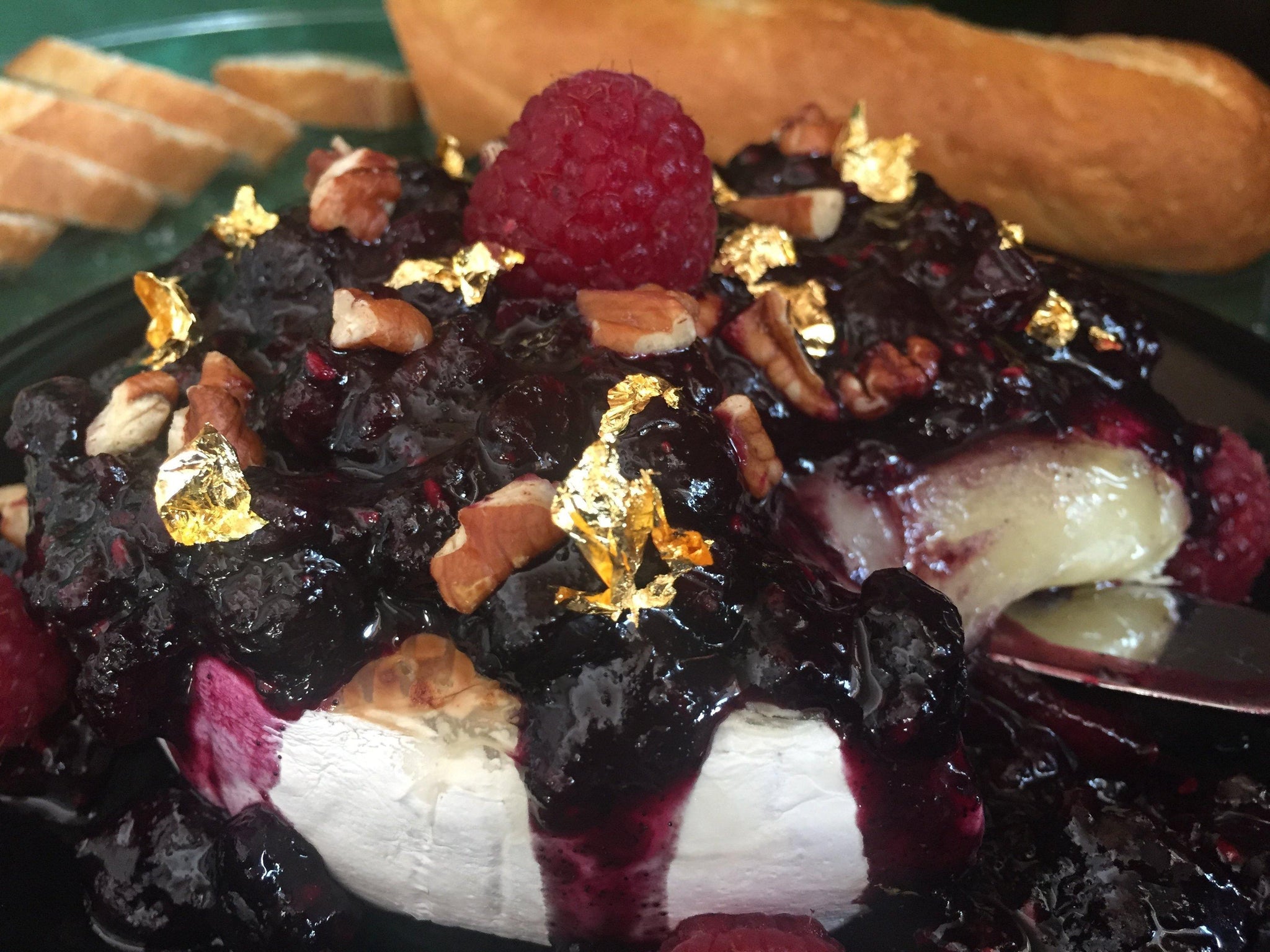 Baked Brie with Vanilla Bean Berry Compote, Pecans, & Gold Leaf
