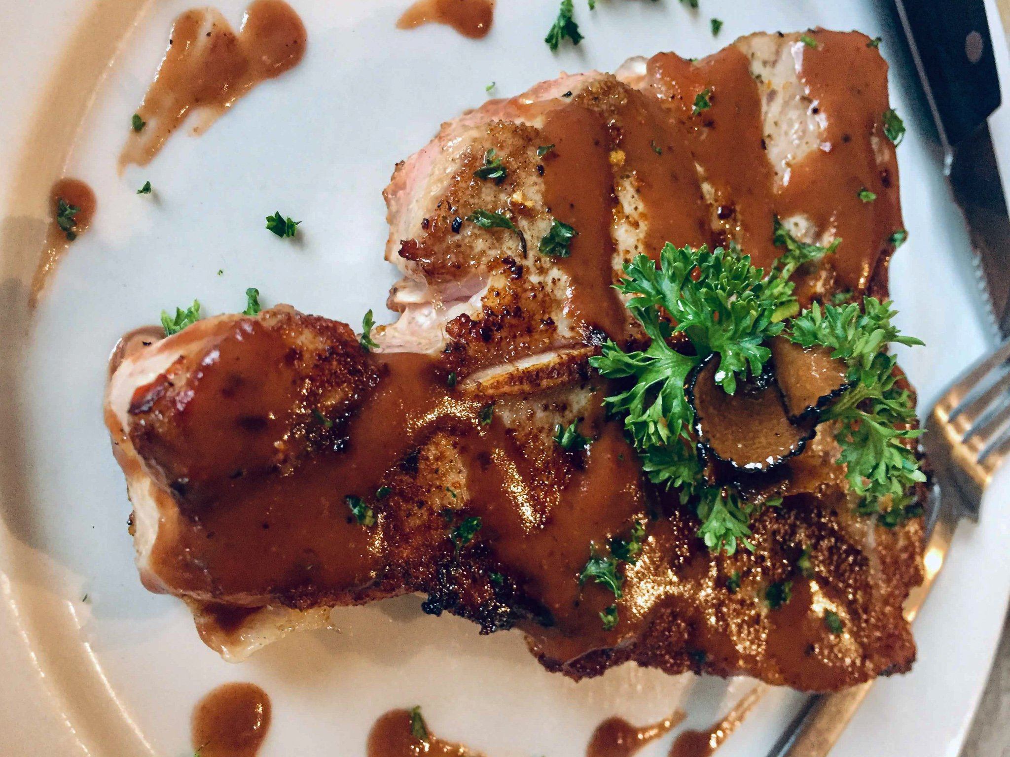 Black Truffle Sauce Served Over Bone-In Veal Chops
