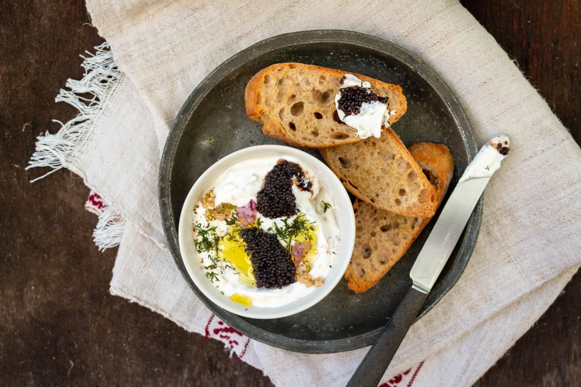 Lumpfish caviar with sour cream spread and baguette