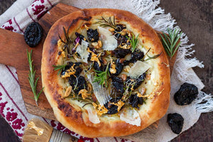 Pizza Bianca with Smoked Plums, Parmesan, Garlic Confit, and Edible Gold