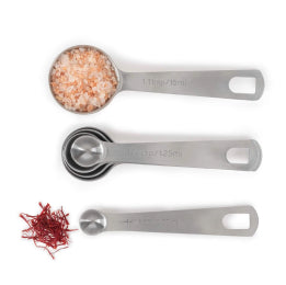 a collection image of Stainless steel measuring spoon set with saffron and salt on white background